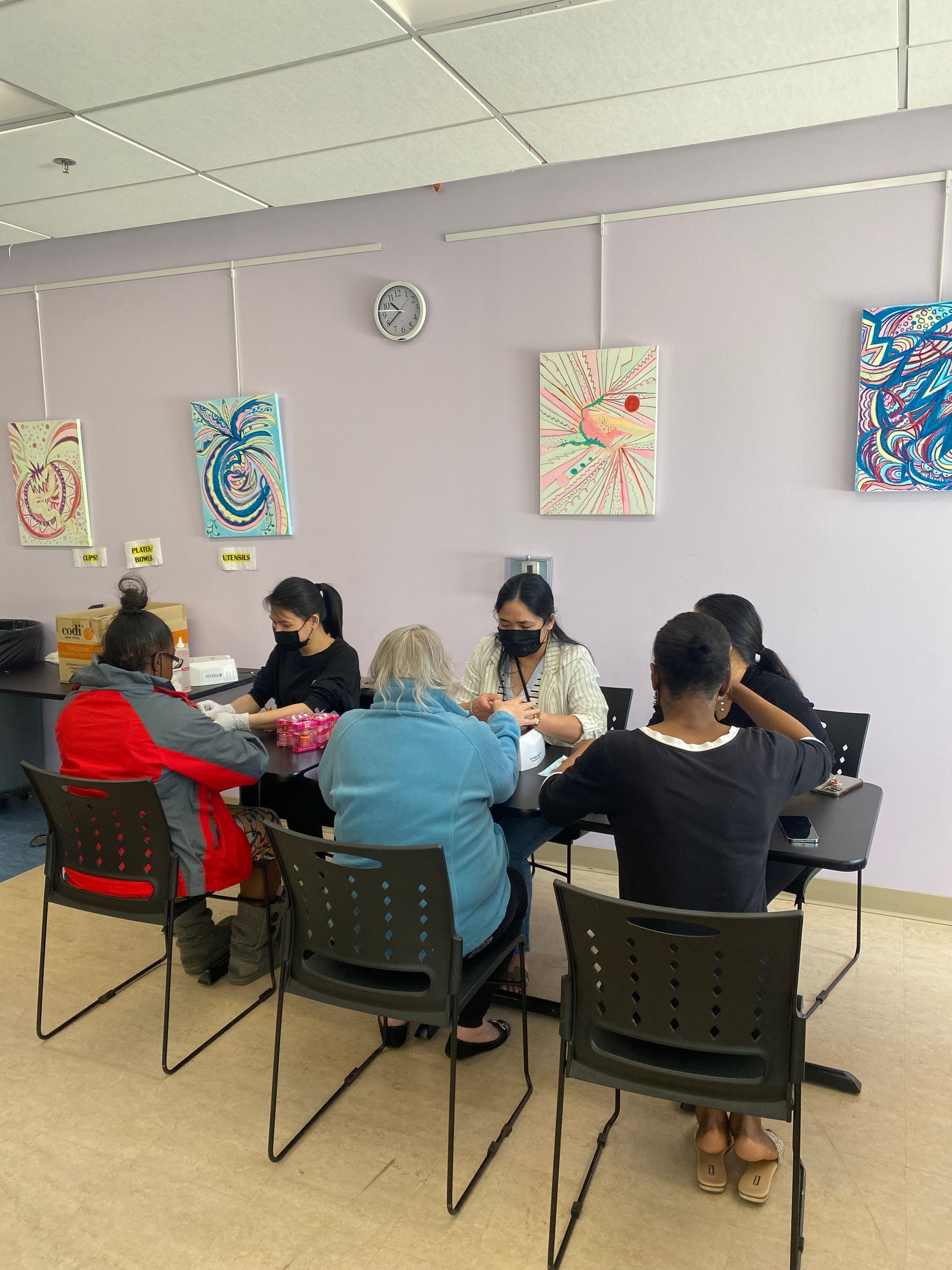 nail techs donating their time at a women's shelter