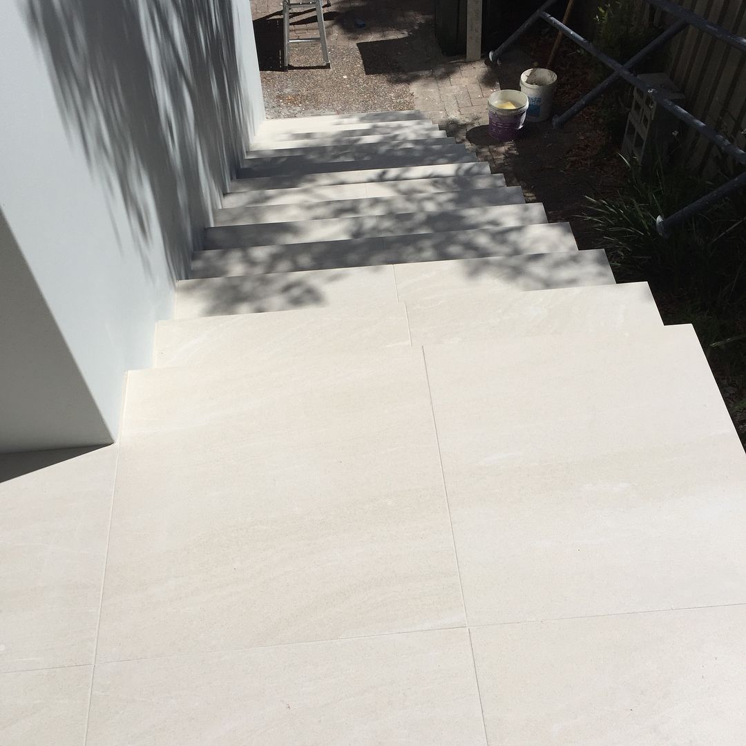 Outdoor Stone Stairs Leading Down, Walls on the Left and Railing on the Right — Seeto Tiling in Nelson Bay, NSW