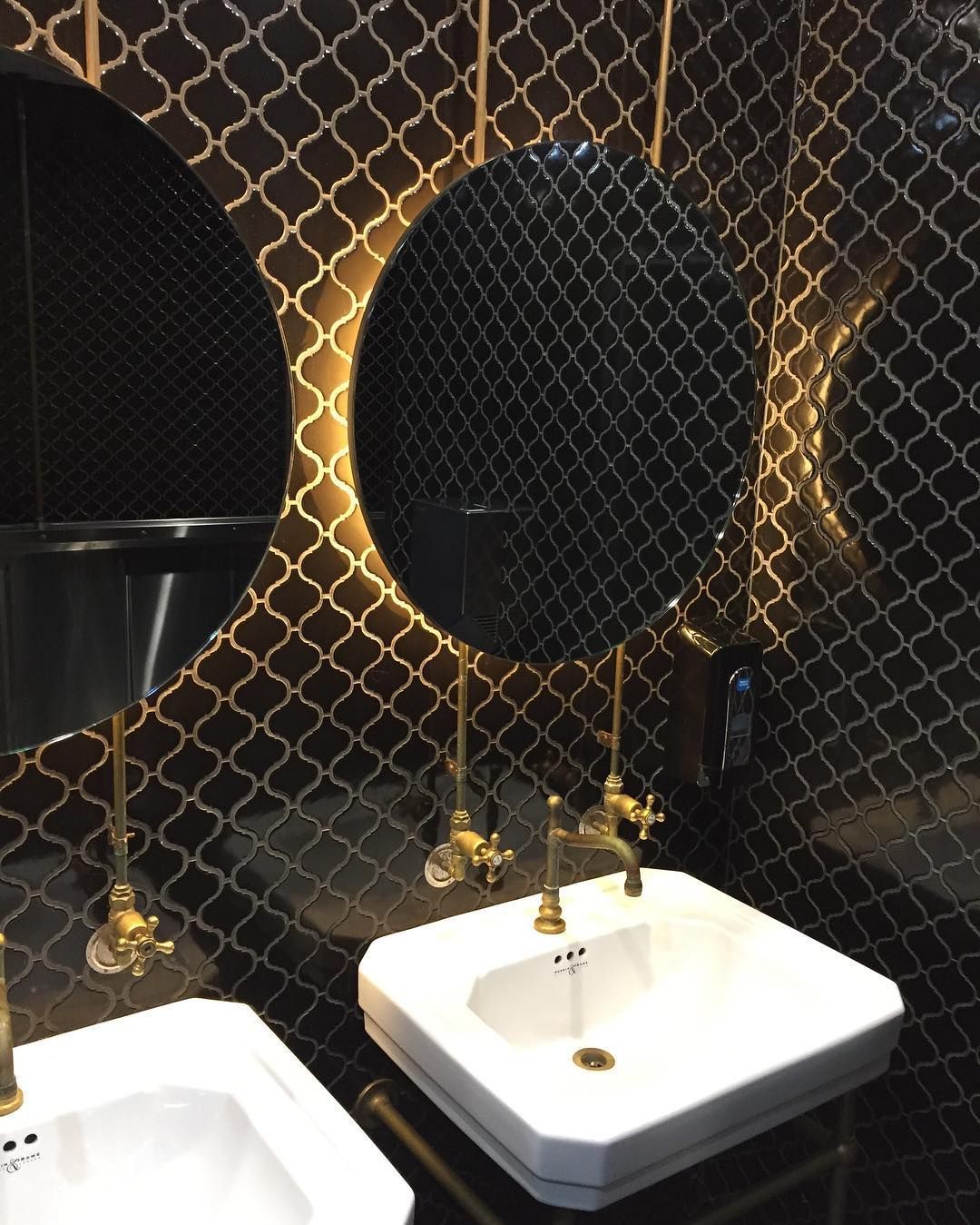 Bathroom With Black and Gold Tile, Round Mirrors, Sinks and Gold Fixtures — Seeto Tiling in Raymond Terrace, NSW
