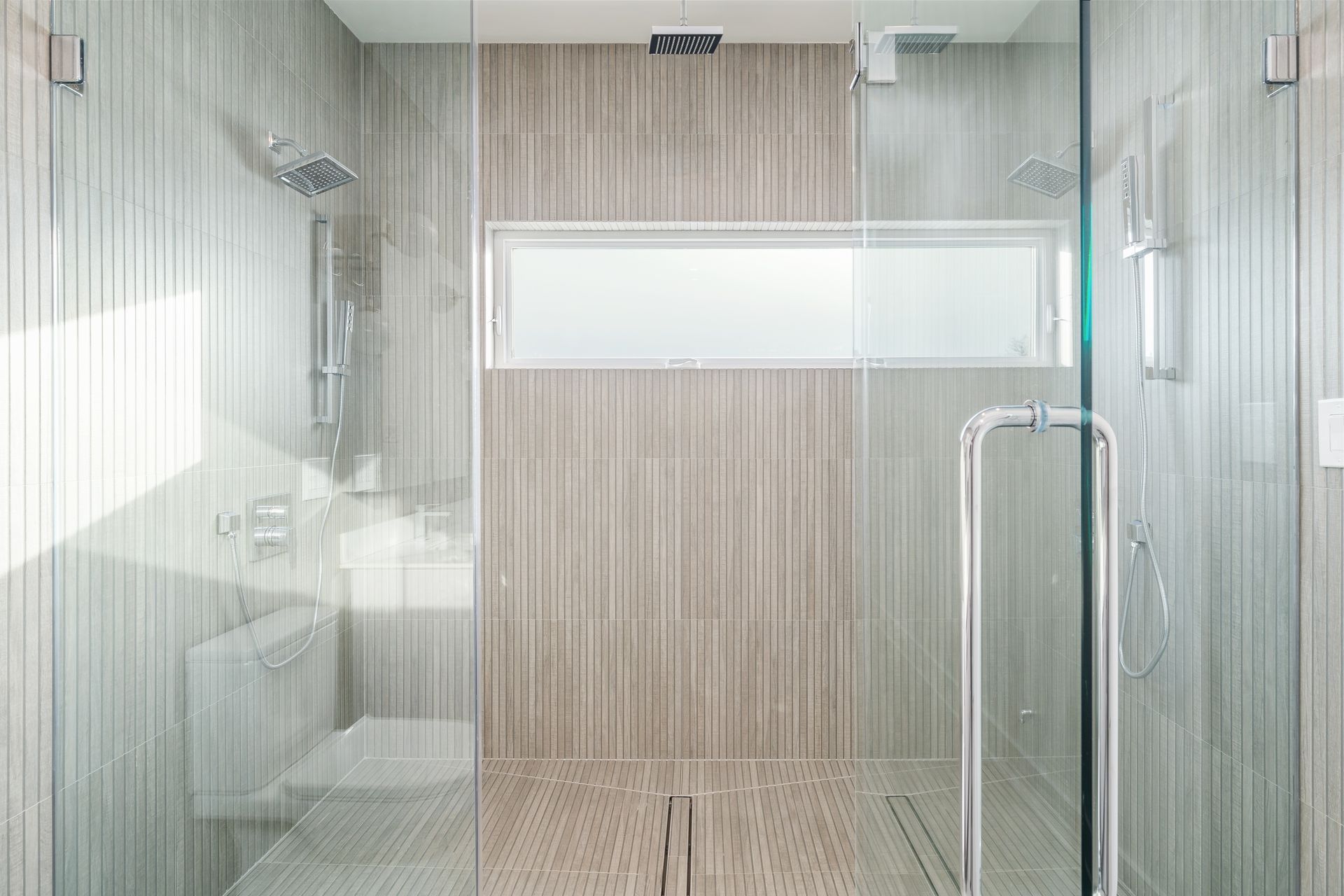 A bathroom with a walk in shower and a toilet.