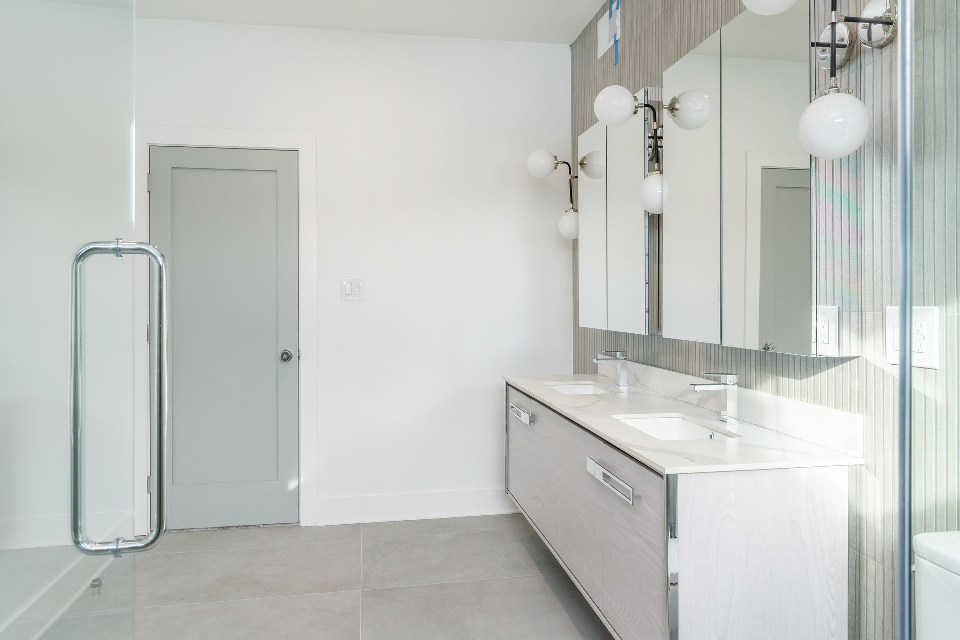 A bathroom with two sinks and two mirrors.