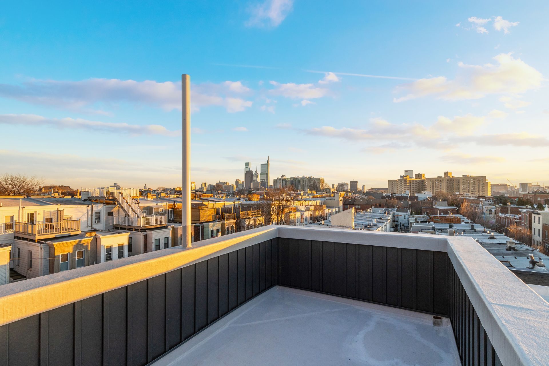 There is a rooftop deck with a view of the city.