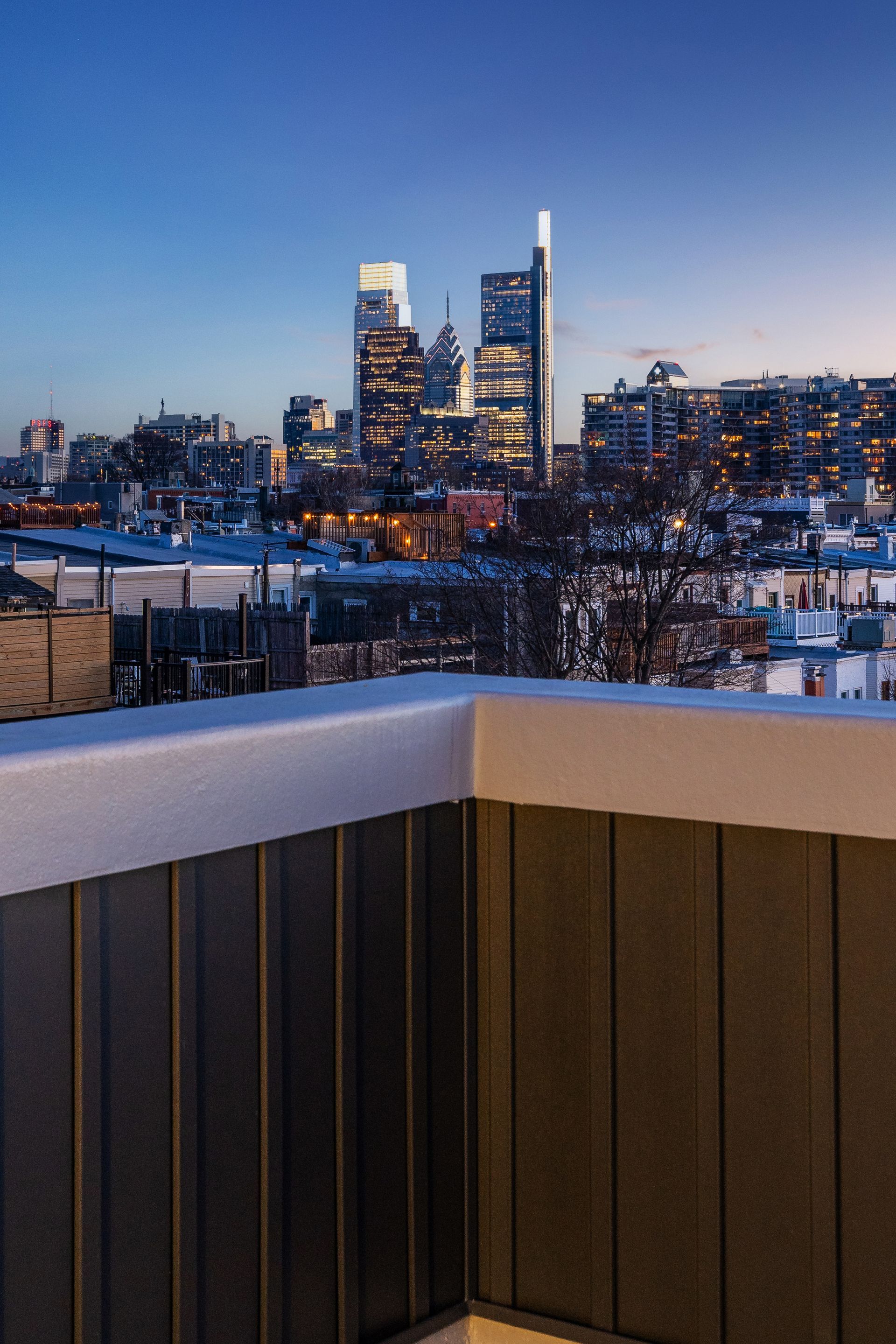 A balcony with a view of a city at night