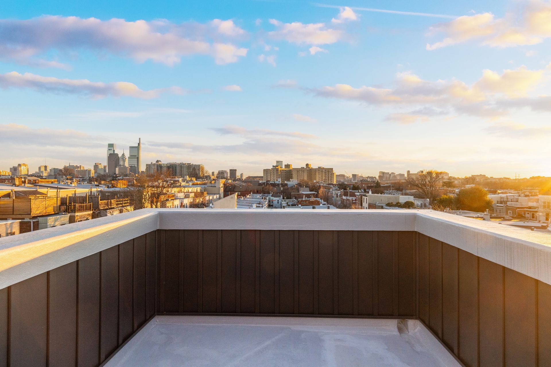 There is a view of the city from the roof of a building.