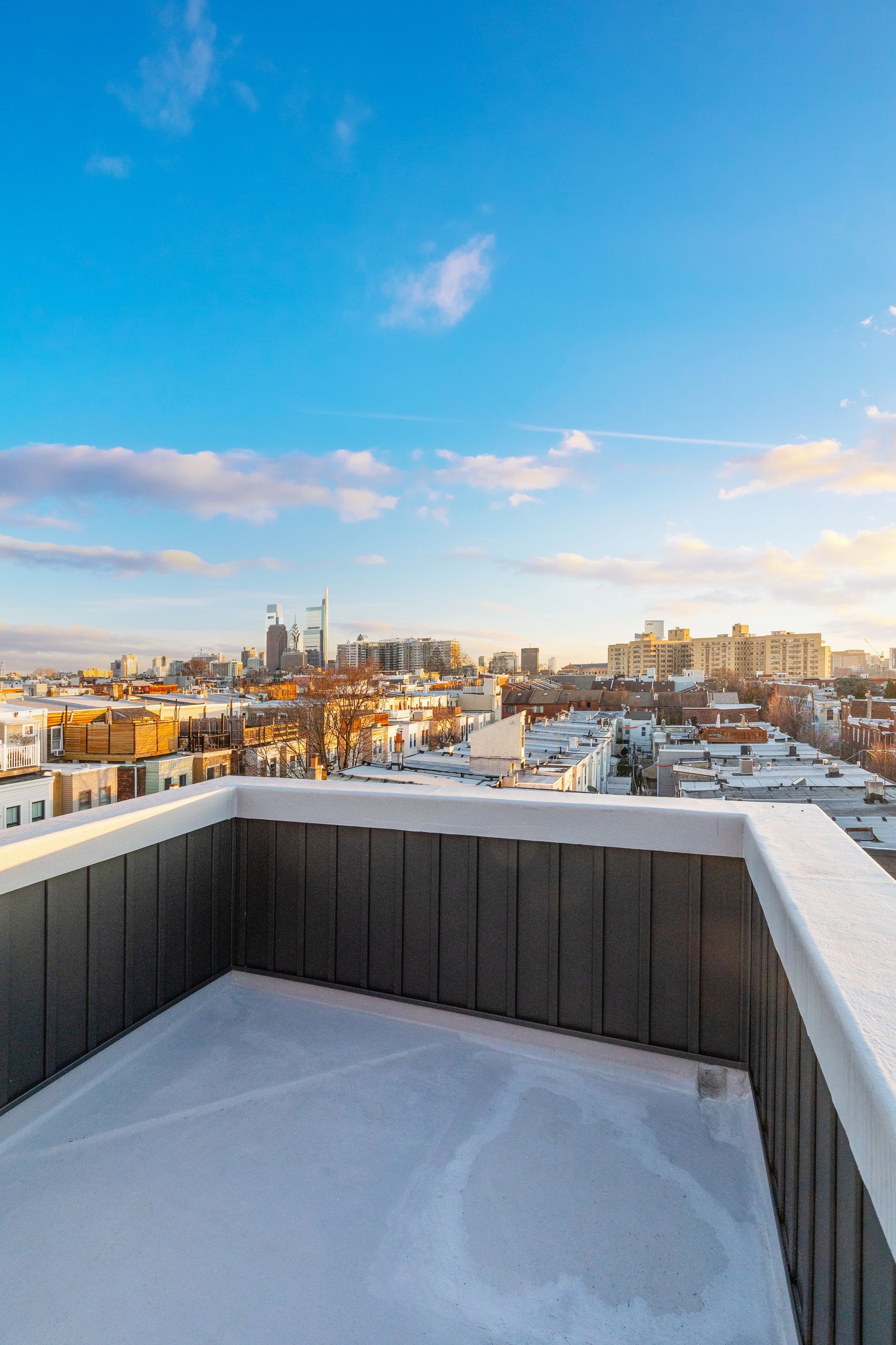 There is a rooftop deck with a view of the city.