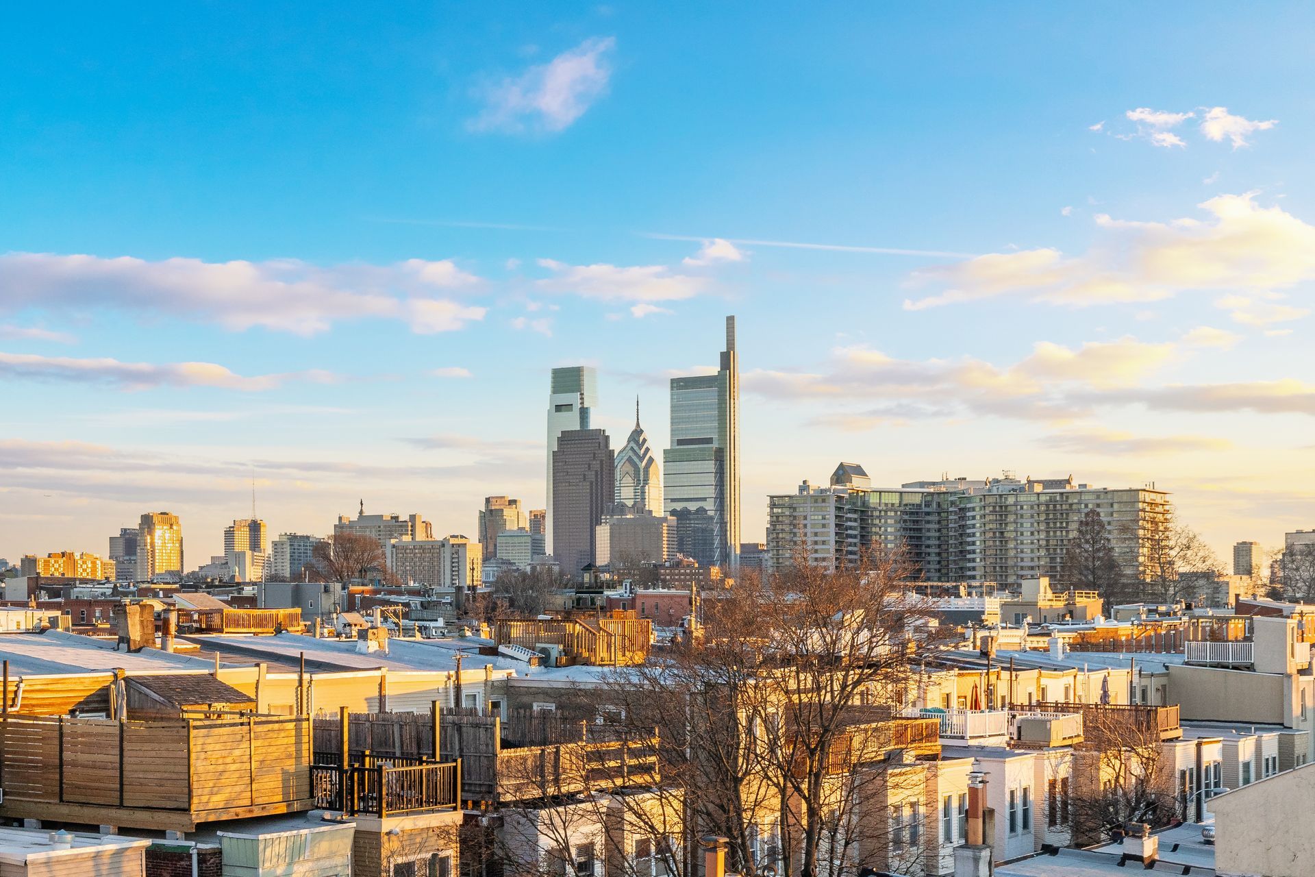 An aerial view of a city skyline at sunset.