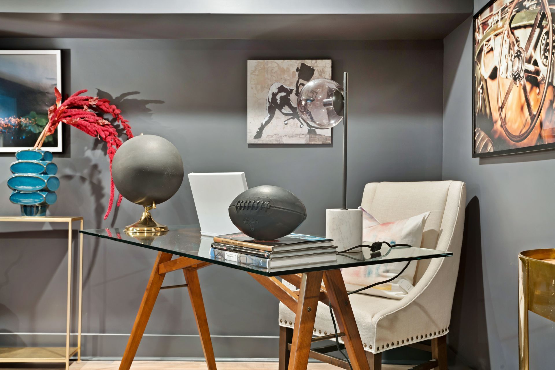 A home office with a glass desk and chair.
