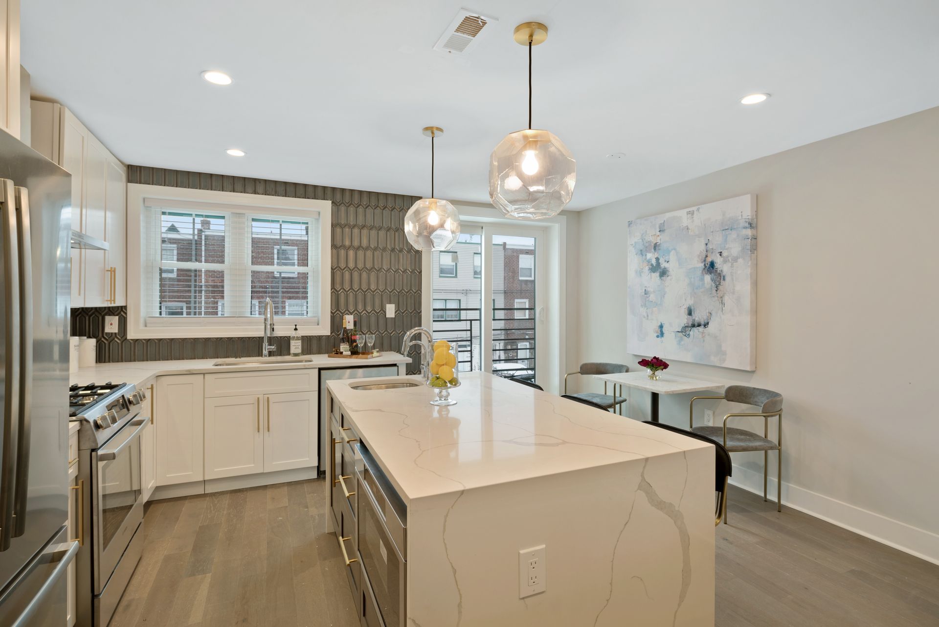 A kitchen with a large island in the middle of it