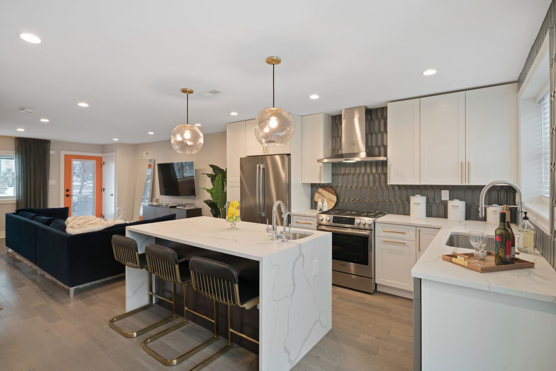 A kitchen with a large island in the middle of the room.