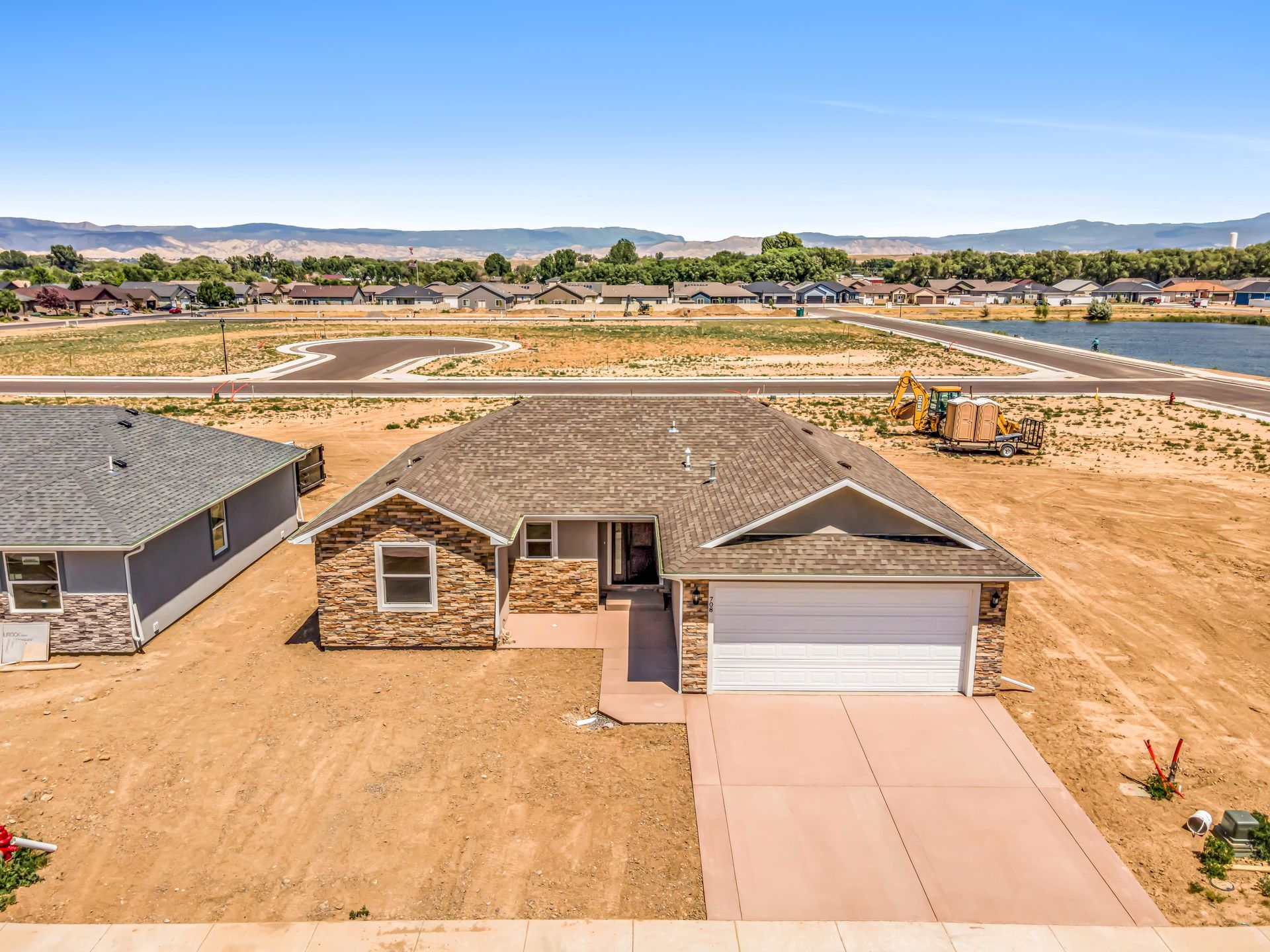 An aerial view of a house in a residential area.