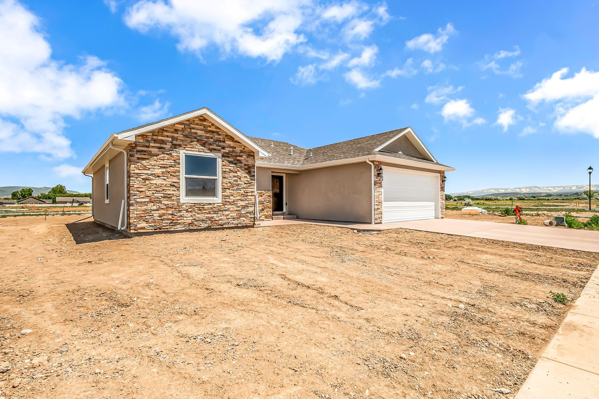 A house with a lot of dirt in front of it