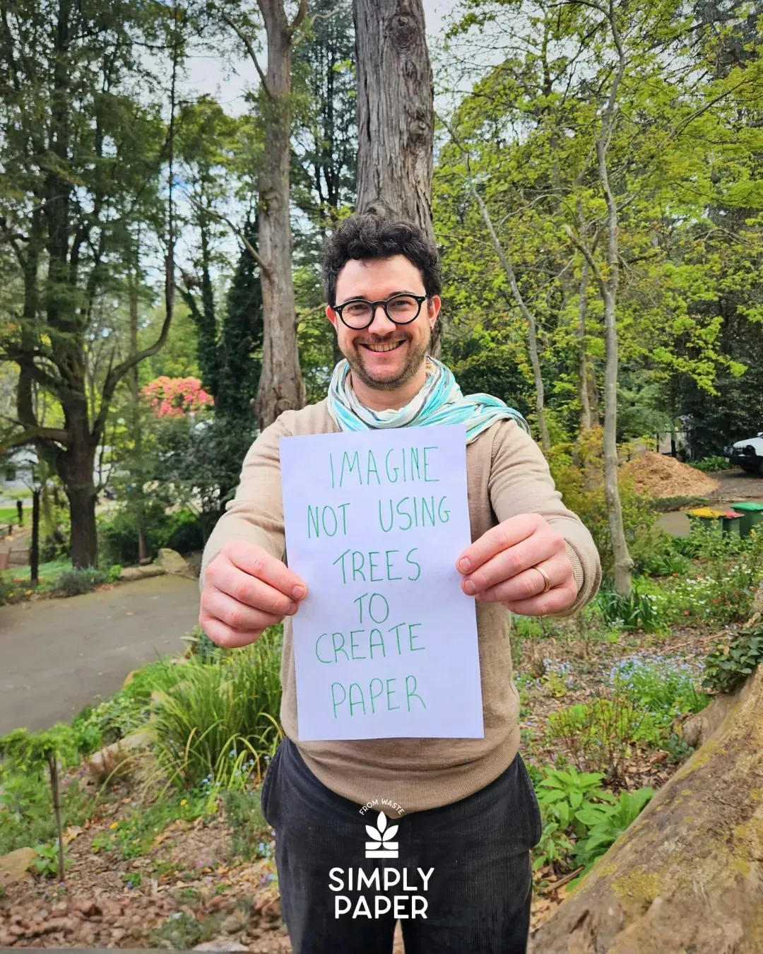 Man holding sign that reads