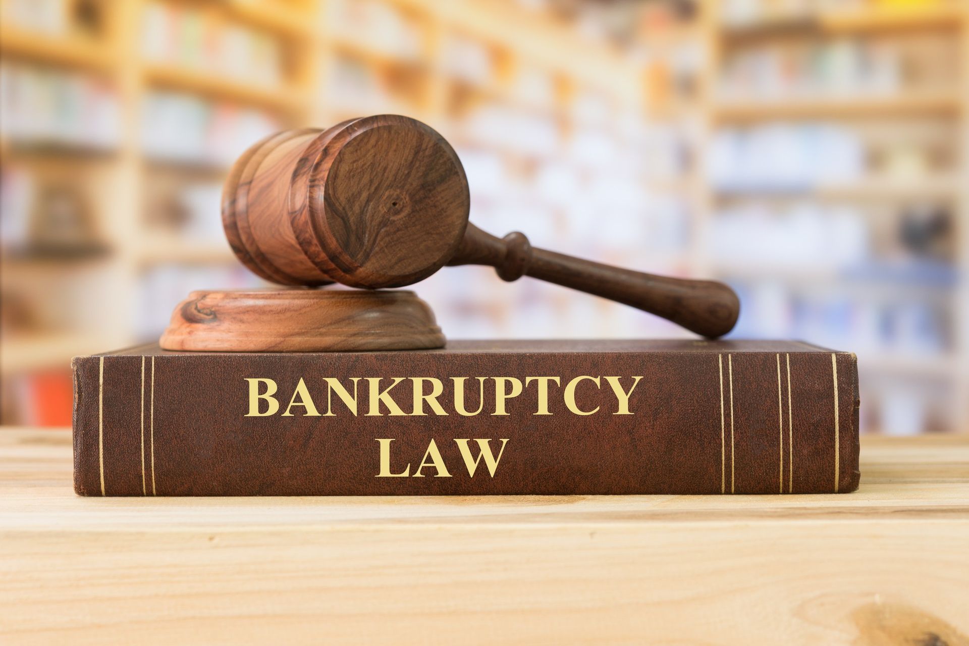 Gavel on Bankruptcy Law book in library – legal authority, financial law, court justice concept.