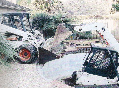 Residential Pool Removal Services — Truck Loader Picking-up Pool Debris in Houston, TX