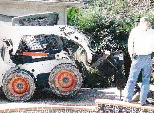 Residential Pool Removal Services — Construction Truck Destructing the Pool Side in Houston, TX
