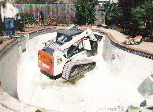 Swimming Pool Destruction & Service — Heavy Equipment Demolishing the Pool in Houston, TX