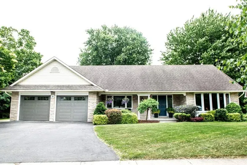A house with two garage doors and a driveway