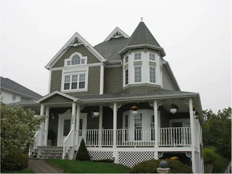 A large house with a tower on top of it