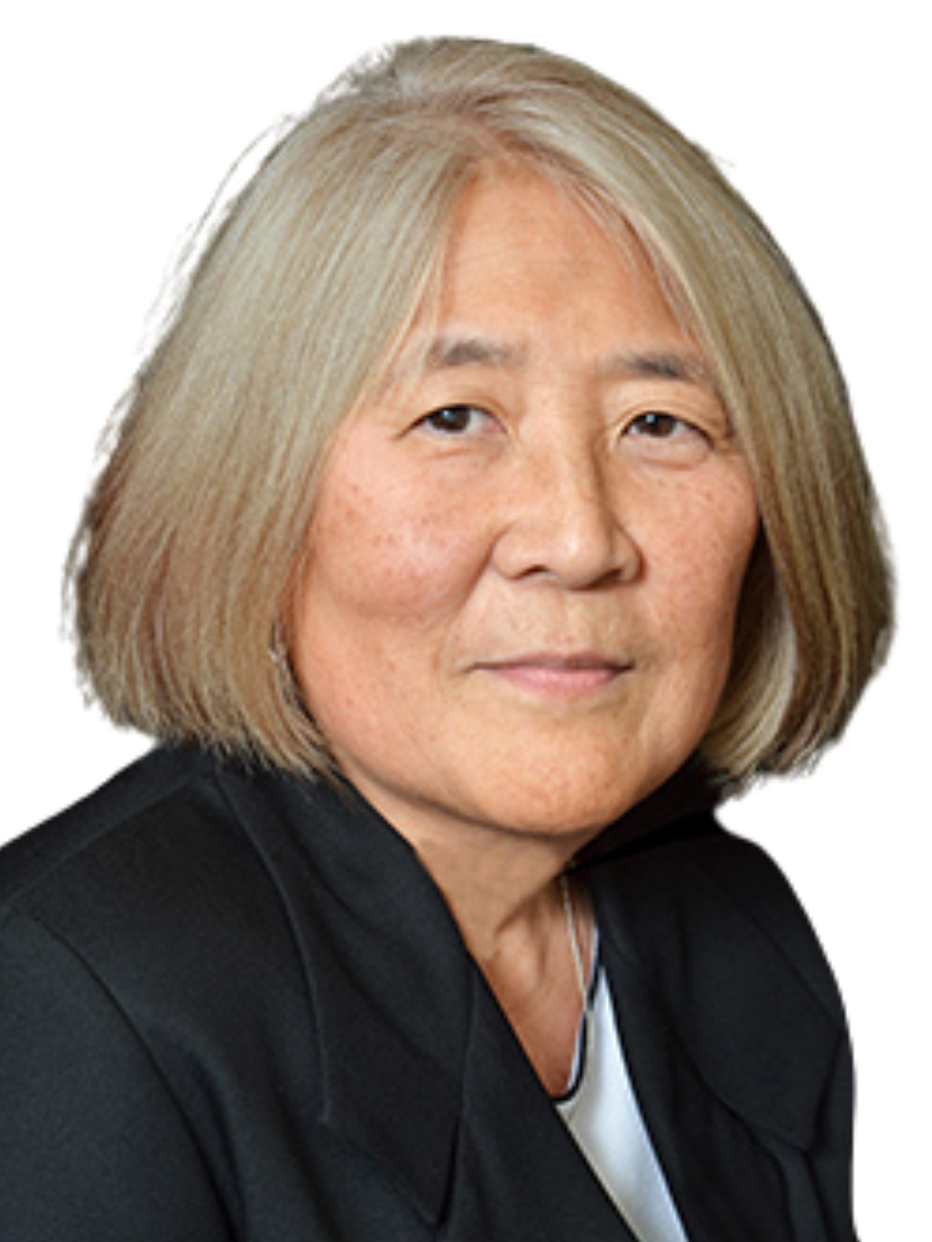 Portrait of an Asian woman with short blonde hair, wearing a black blazer, smiling slightly.