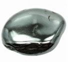 Smooth, polished, dark-gray hematite gemstone with reflective surface.