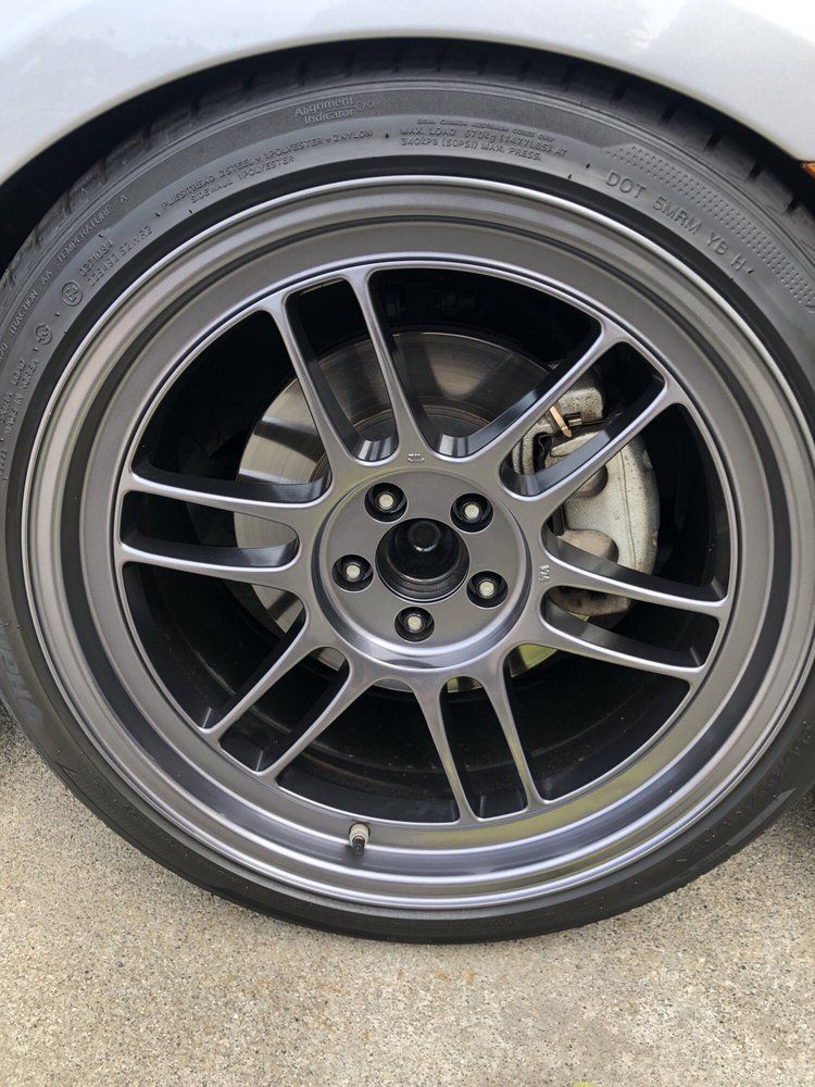 A close up of a car wheel with a tire on it.