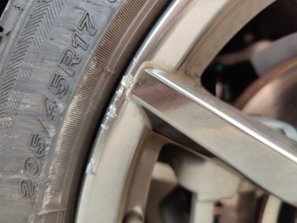 A close up of a tire on a car wheel