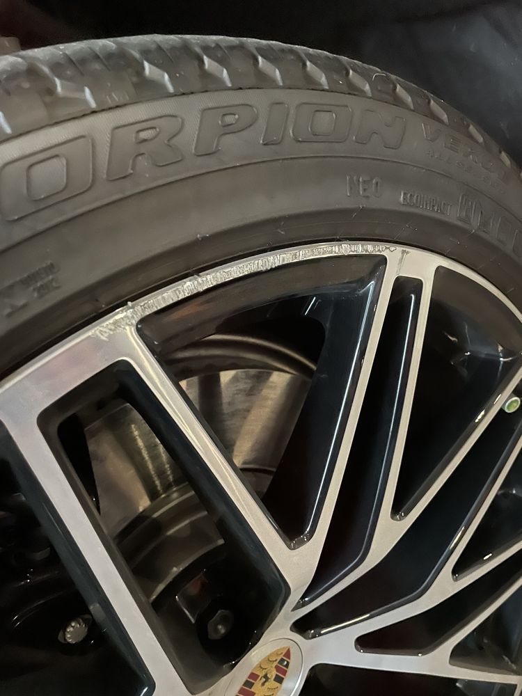 A close up of a scorpion tire on a car wheel