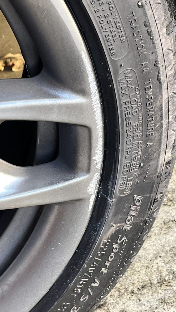 A close up of a tire on a car wheel