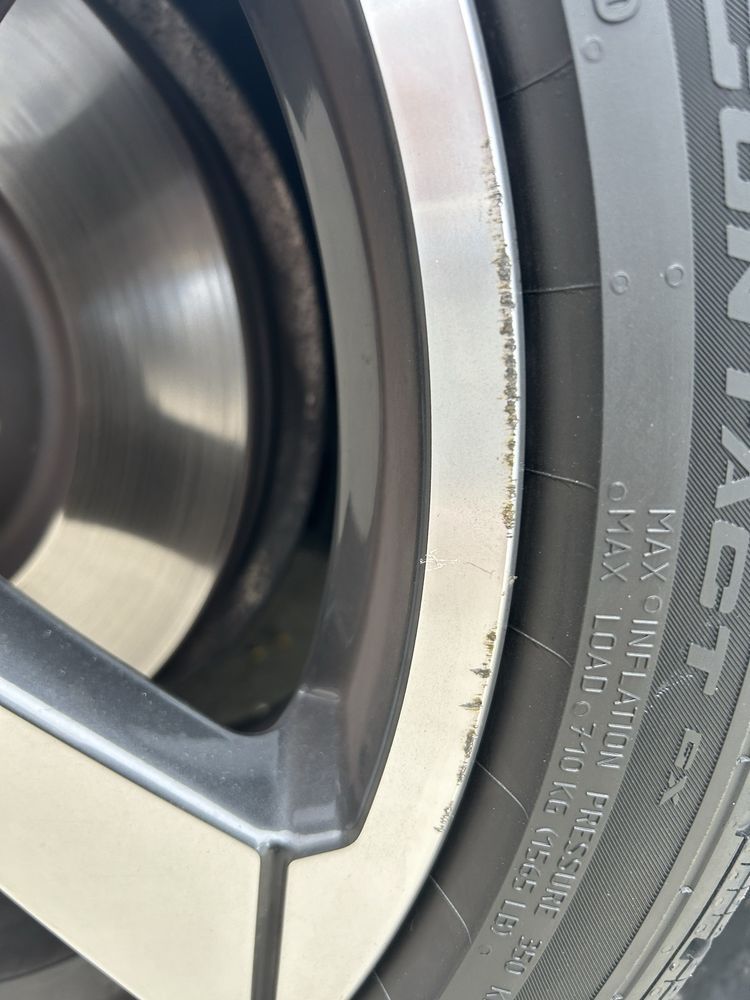 A close up of a tire that says contact on it