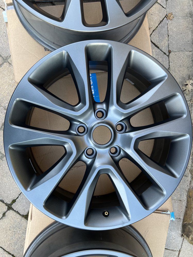 A close up of a wheel on a cardboard box