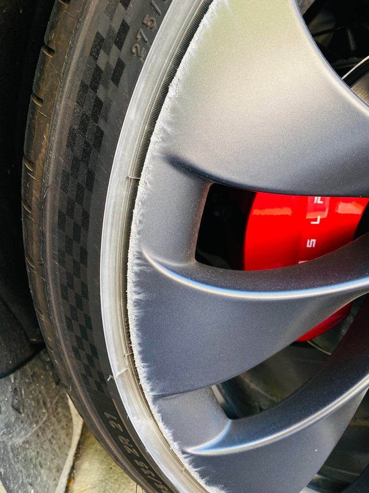 A close up of a tire on a tesla model 3