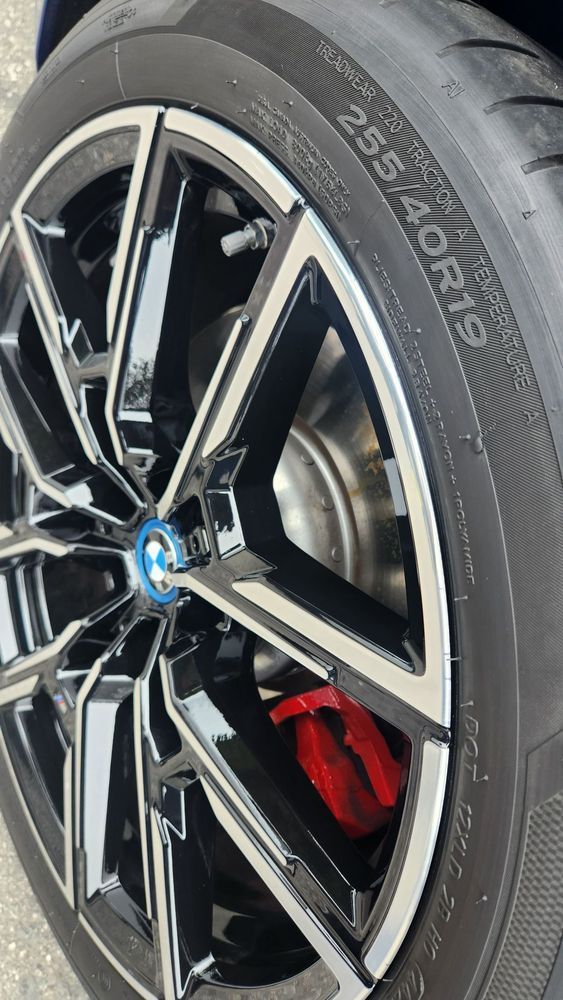 A close up of a car wheel with a tire on it.