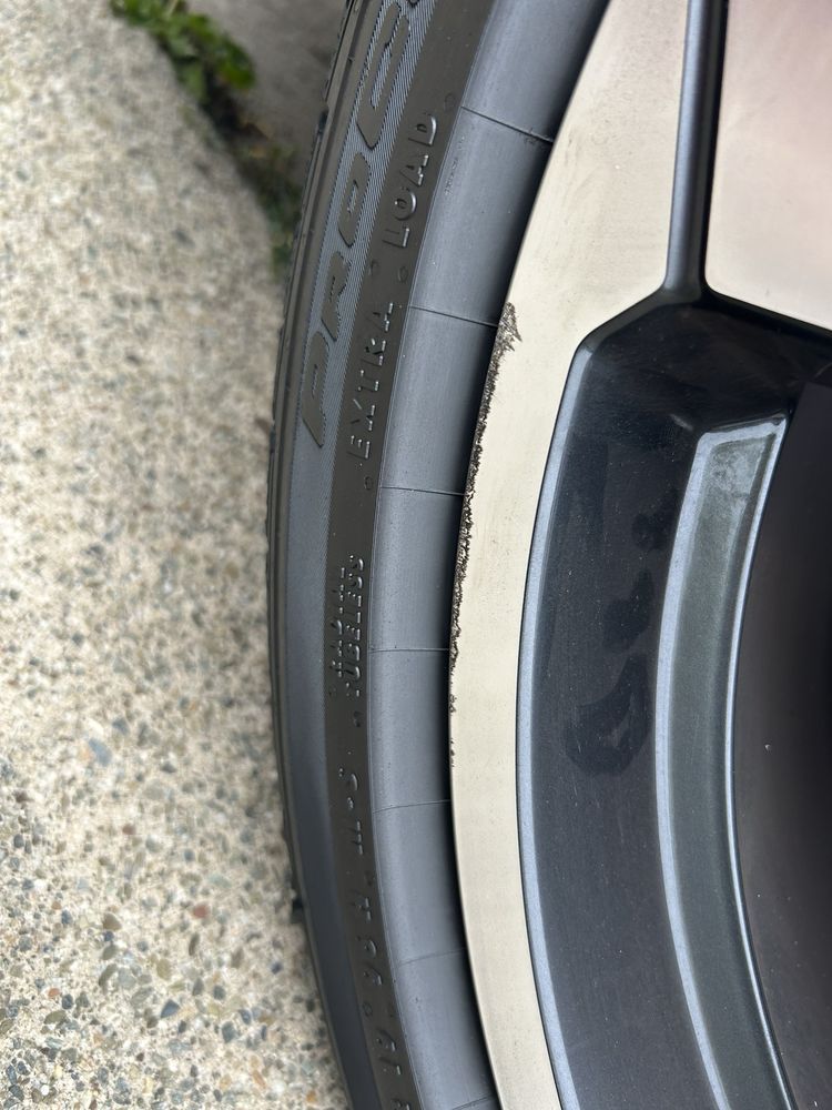 A close up of a tire on a car wheel.
