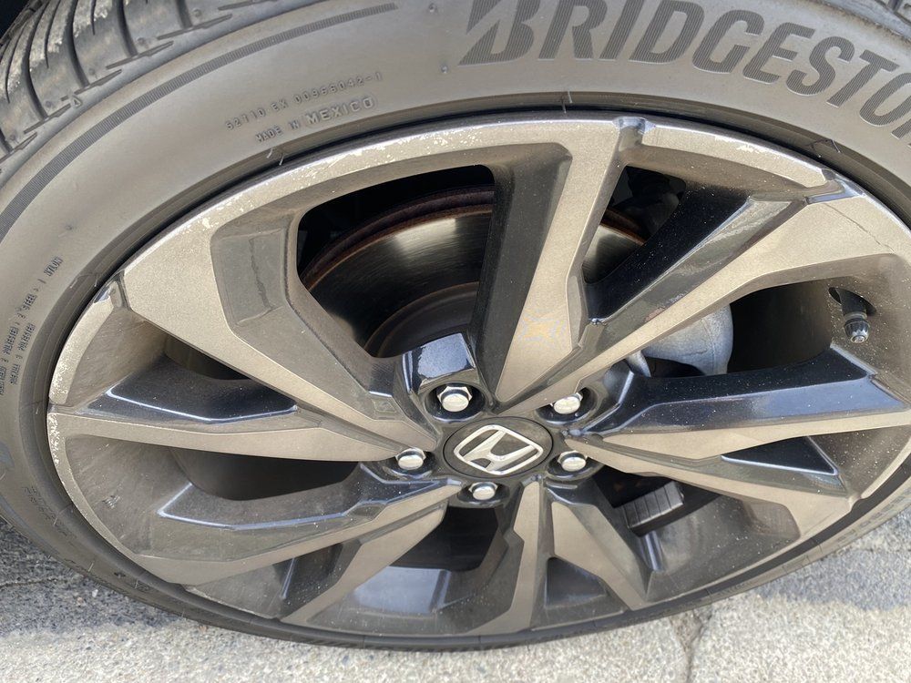 A close up of a bridgestone tire on a honda