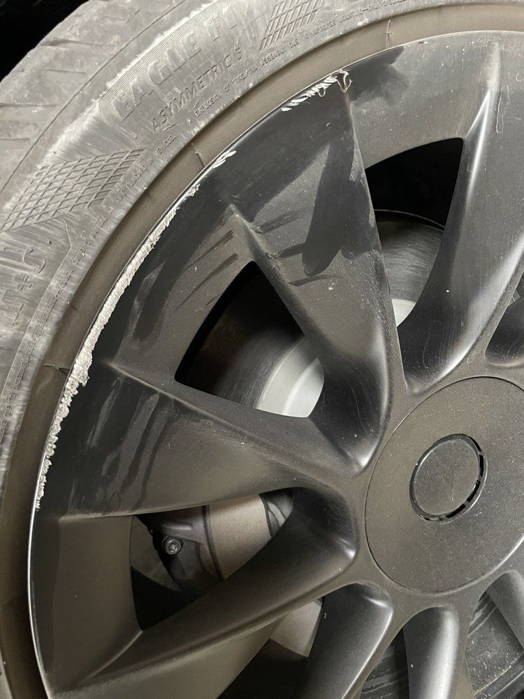 A close up of a car wheel with a tire on it.