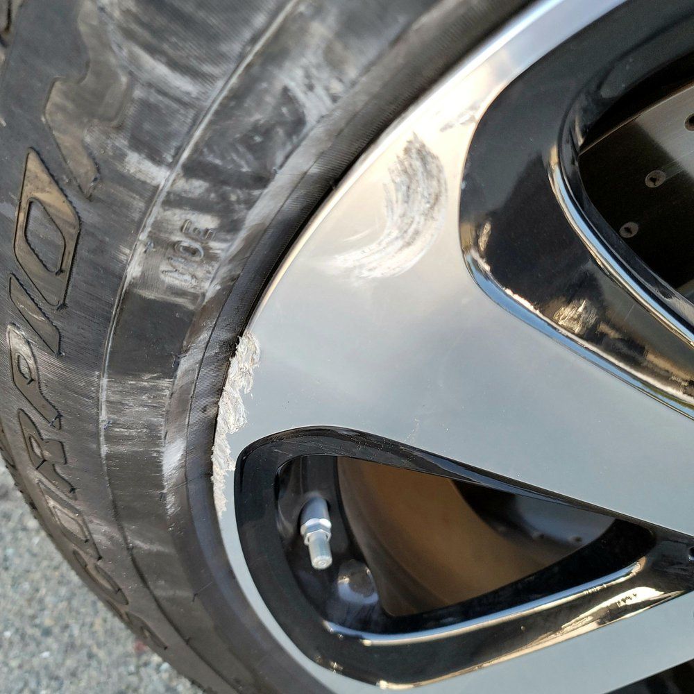 A close up of a tire and rim on a car