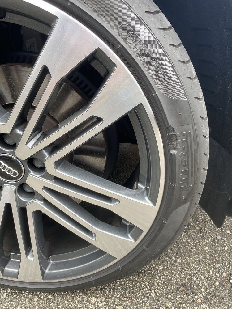 A close up of a car wheel with a tire on it.