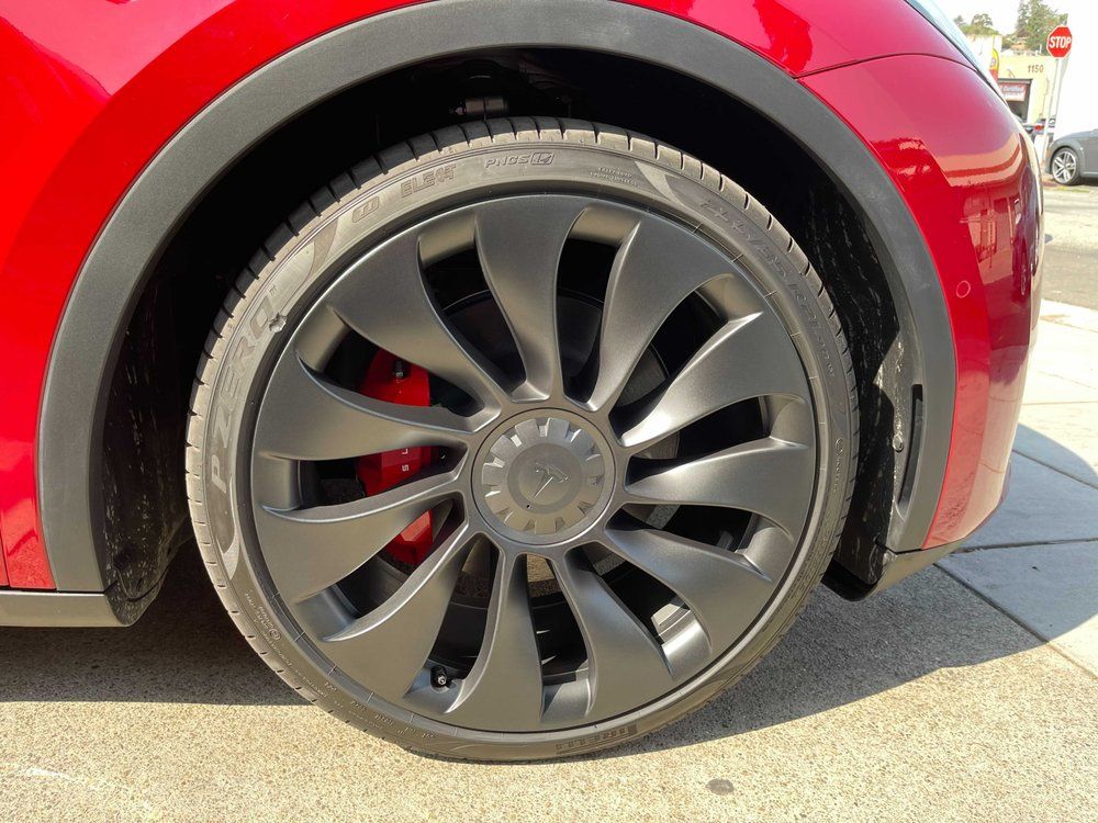 A close up of a tesla model y wheel