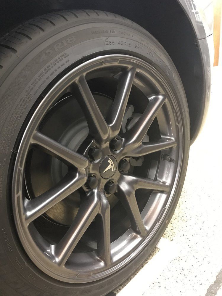 A close up of a car wheel with a tire that says michelin