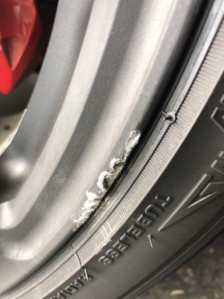 A close up of a tire on a car wheel