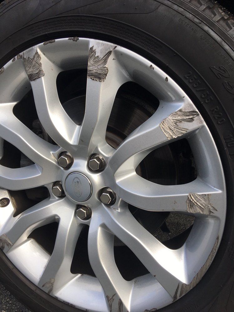 A close up of a car wheel with a tire on it