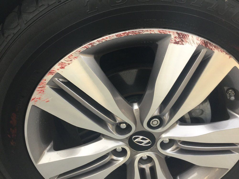 A close up of a car wheel with a hyundai logo on it