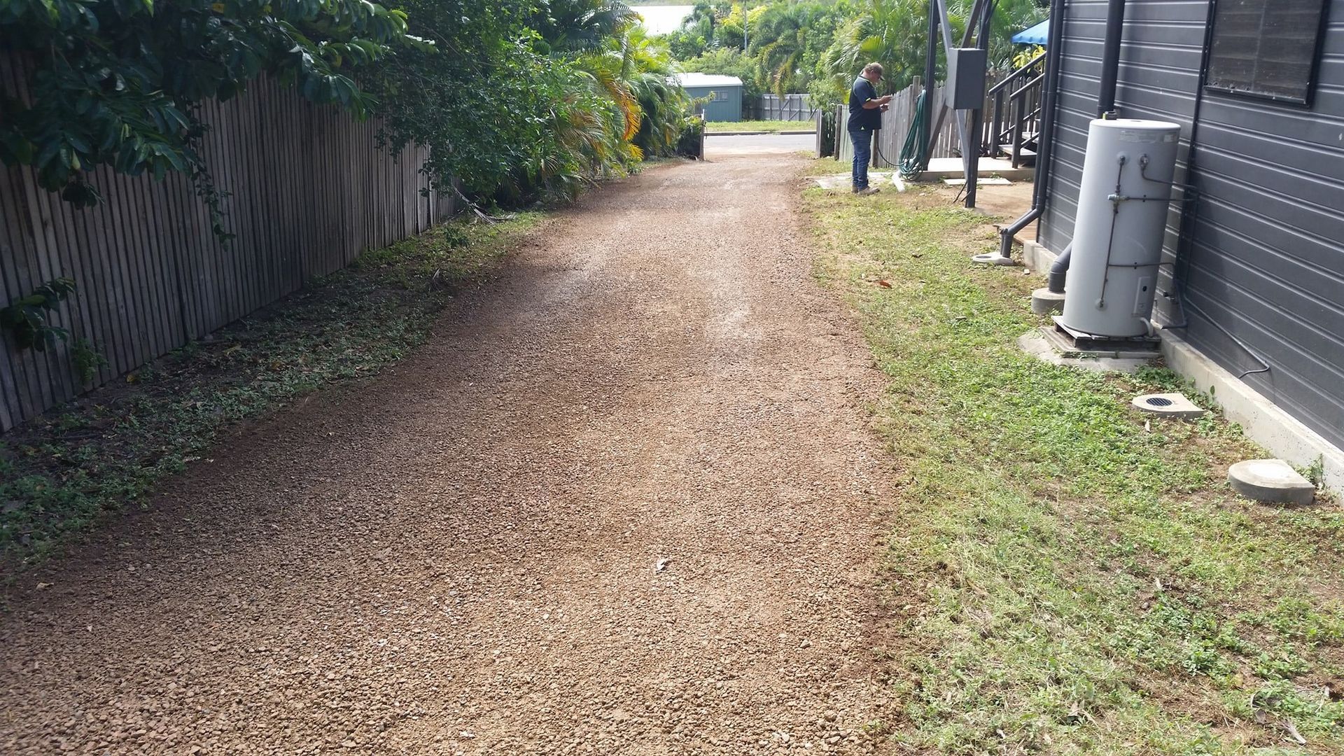 A Gravel Driveway Leading To A House With A Fence In The Background — Allsites Earthworx In Garbutt, QLD