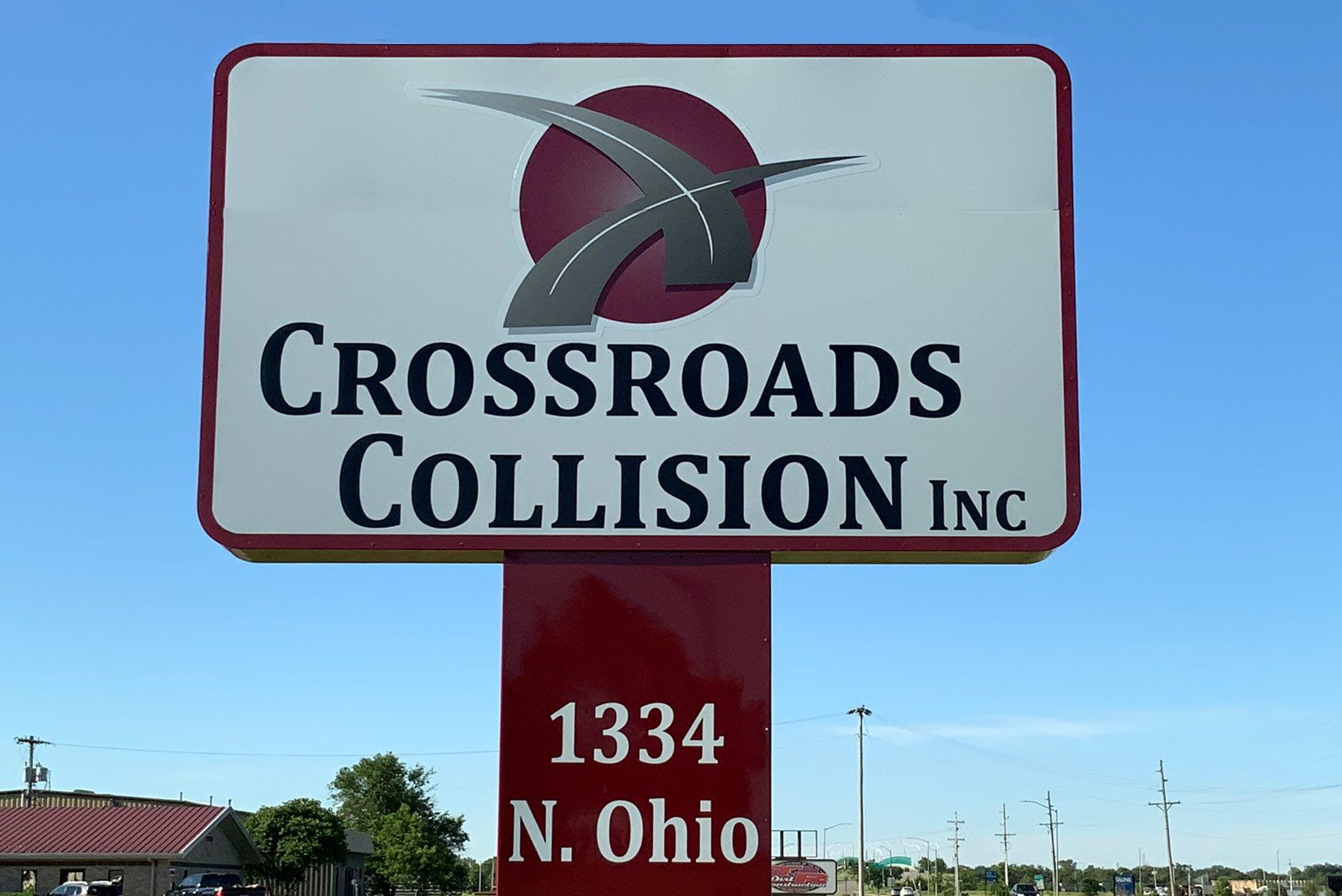 crossroads collision inc. business sign in parking lot  of business