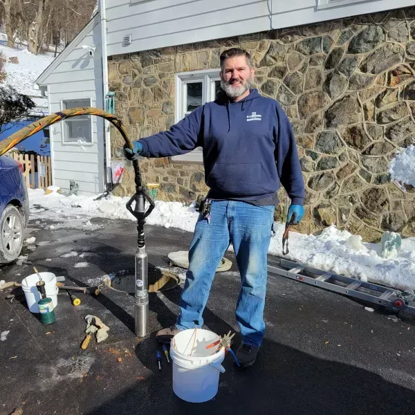 Man Replacing Water Pump — Nazareth, PA — Keystone Pump & Well Service