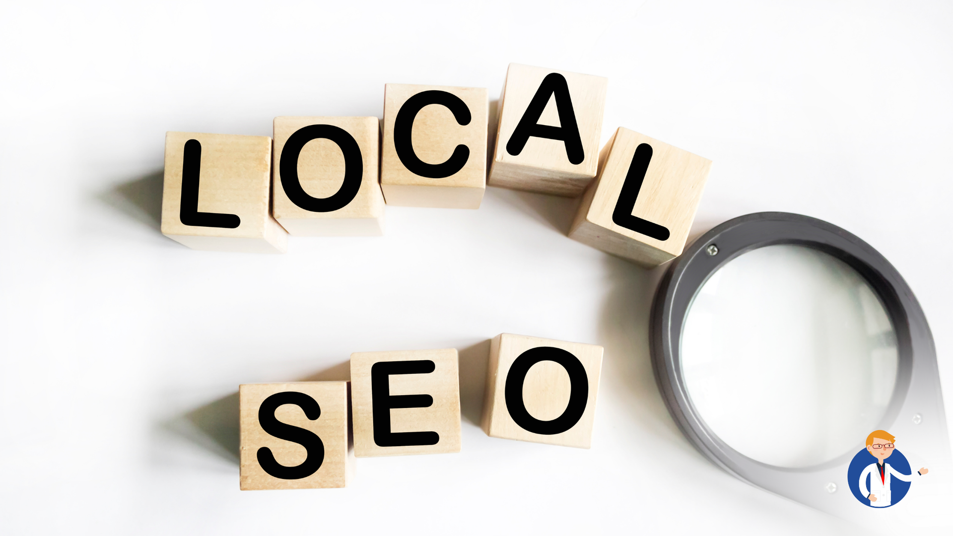 The word local seo is written on wooden blocks next to a magnifying glass.