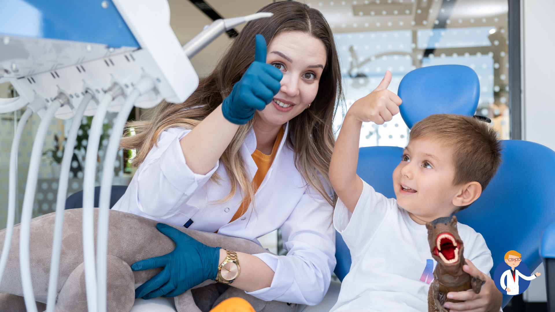 A female dentist is giving a thumbs up to a young boy in a dental chair.