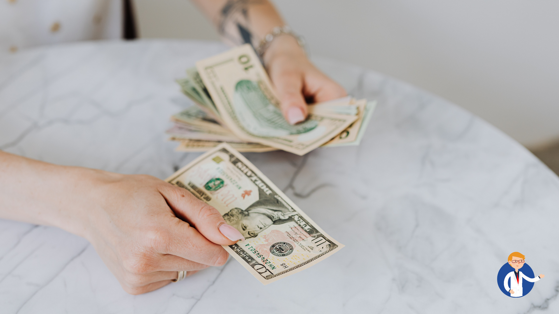 A woman is sitting at a table counting money.