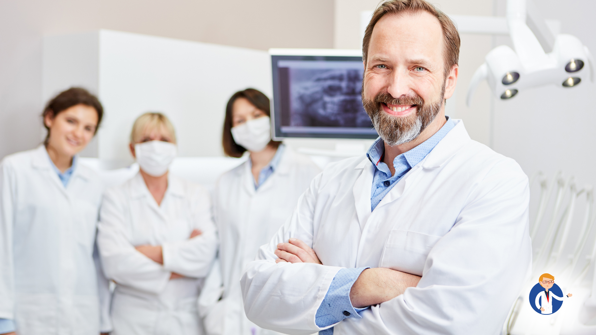 A dentist is posing for a picture with his arms crossed in a dental office.