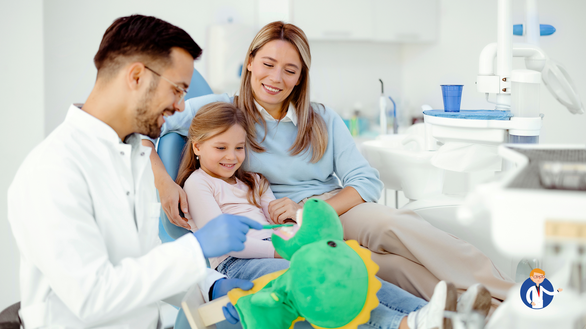 A little girl is sitting in a dental chair with a stuffed dinosaur.